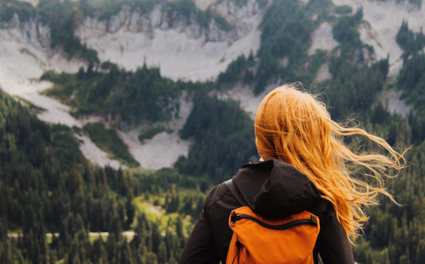 Healthcare traveler overlooking a mountain landscape