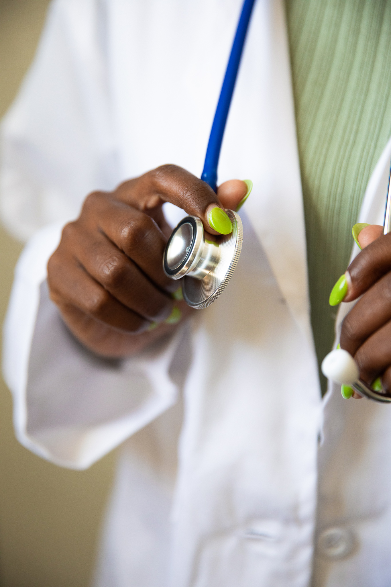 doctors hand holding stethoscope